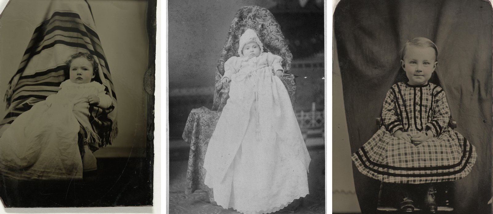 Three old portraits of small children side by side: a little girl on the lap of someone hidden under a striped shawl, a baby in a long white gown held up by someone covered in a patterned cloth, and a toddler seated in front of a dark curtain